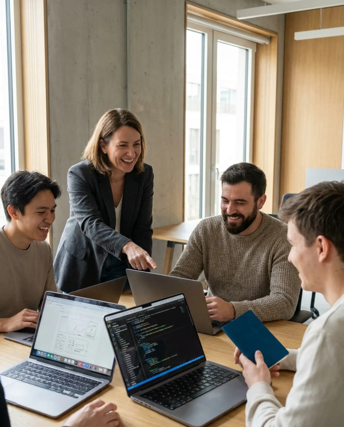 A modern, human workplace where a diverse team collaborates on digital products.